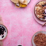 Granola on pink tile background